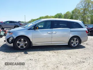 2012 Honda Odyssey Touring with VIN 5FNRL5H96CB043939, listed as a IAAI auction lot 41983643 with 202,535 mi miles. Bid and sale history available at carsss.com. Image 15.
