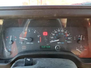 1999 Jeep Wrangler SE with VIN 1J4FY29P8XP483909, listed as a Copart auction lot 48679555 with 168,708 mi miles and Salvage title. Bid and sale history available at DreamBid. Image 9.