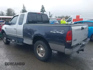 2000 Ford F-150 XL z VIN 1FTRX18L8YKA72409, wystawiony jako IAAI lot #41928360 z przebiegiem 167 251 mil mil oraz . Historia ofert i sprzedaży dostępna na DreamBid. Obrazek 3.