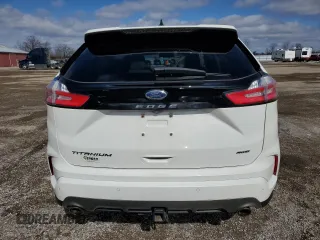 2021 Ford Edge Titanium z VIN 2FMPK4K93MBA52444, wystawiony jako Copart lot #51752835 z przebiegiem 67 137 mil mil oraz Czysty tytuł • Clean title. Historia ofert i sprzedaży dostępna na DreamBid. Obrazek 6.