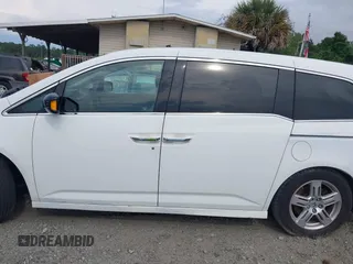 2011 Honda Odyssey Touring with VIN 5FNRL5H90BB066177, listed as a IAAI auction lot 42053368 with 239,205 mi miles and . Bid and sale history available at carsss.com. Image 14.