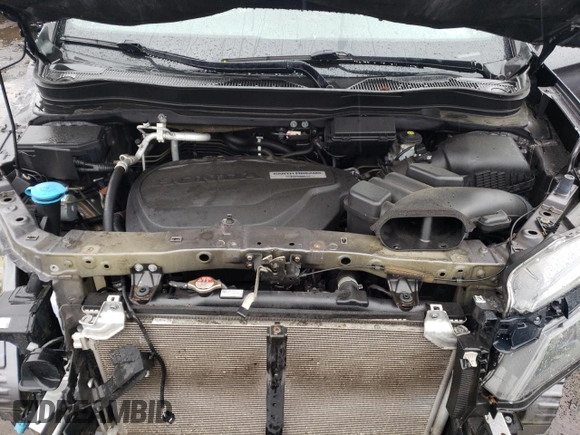 2019 Honda Passport EX-L z VIN 5FNYF8H50KB028465, wystawiony jako Copart lot #56160545 z przebiegiem 100 636 mil mil oraz Szkoda całkowita • Salvage title. Historia ofert i sprzedaży dostępna na DreamBid. Obrazek 12.