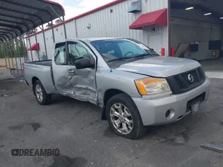 2012 Nissan Titan SE with VIN 1N6BA0CH0CN326229, listed as a IAAI auction lot 41975273 with 106,946 mi miles. Bid and sale history available at carsss.com. Image 1.