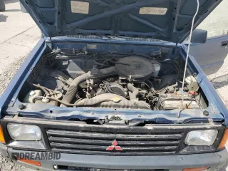 1989 Mitsubishi Mighty Max z VIN JA7FL24D7KP055207, wystawiony jako Copart lot #53172405 z przebiegiem 118 439 mil mil oraz Szkoda całkowita • Salvage title. Historia ofert i sprzedaży dostępna na DreamBid. Obrazek 12.