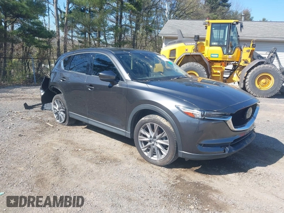 2020 Mazda CX-5 Grand Touring with VIN JM3KFBDM1L0821975, listed as a IAAI auction lot 40088794 with 68,895 mi miles and . Bid and sale history available at DreamBid. Image 1.