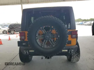 2013 Jeep Wrangler Unlimited Sport z VIN 1C4BJWDGXDL556580, wystawiony jako Copart lot #55477185 z przebiegiem 71 044 mil mil oraz Szkoda całkowita • Salvage title. Historia ofert i sprzedaży dostępna na DreamBid. Obrazek 6.