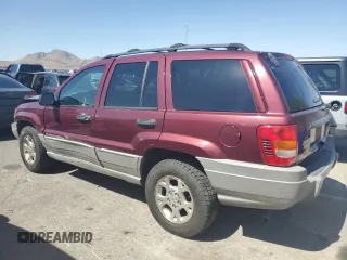 2000 Jeep Grand Cherokee Laredo with VIN 1J4G248S1YC407769, listed as a Copart auction lot 61653545 with 188,882 mi miles and Salvage title. Bid and sale history available at DreamBid. Image 2.