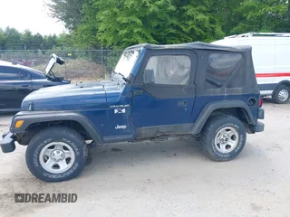 2002 Jeep Wrangler X z VIN 1J4FA39S82P735794, wystawiony jako IAAI lot #42411386 z przebiegiem 141 219 mil mil oraz . Historia ofert i sprzedaży dostępna na DreamBid. Obrazek 12.