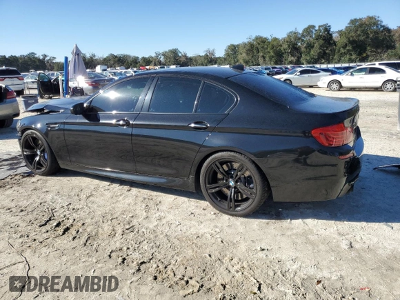 2016 BMW M5 with VIN WBSFV9C57GD595447, listed as a Copart auction lot 41343845 with 50,029 mi miles and Salvage Title. Bid and sale history available at carsss.com. Image 2.