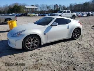 2014 Nissan 370Z Touring with VIN JN1AZ4EH1EM635411, listed as a Copart auction lot 82670344 with 77,501 mi miles and Salvage Title. Bid and sale history available at carsss.com. Image 1.