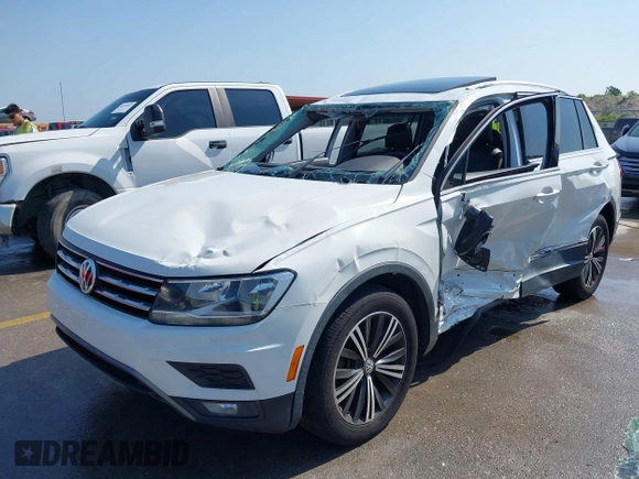 2018 Volkswagen Tiguan SEL z VIN 3VV3B7AX5JM091021, wystawiony jako IAAI lot #42392698 z przebiegiem 107 595 mil mil oraz . Historia ofert i sprzedaży dostępna na DreamBid. Obrazek 2.