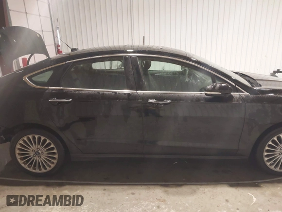 2016 Ford Fusion Titanium with VIN 3FA6P0K96GR197709, listed as a IAAI auction lot 40977902 with 135,259 mi miles. Bid and sale history available at carsss.com. Image 14.