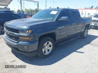 2018 Chevrolet Silverado 1500 LT with VIN 3GCUKREC1JG511846, listed as a IAAI auction lot 42024170 with 121,532 mi miles and . Bid and sale history available at DreamBid. Image 2.