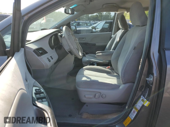 2014 Toyota Sienna LE with VIN 5TDJK3DC0ES080201, listed as a Copart auction lot 55147745 with 133,216 mi miles and Salvage Title. Bid and sale history available at DreamBid. Image 7.