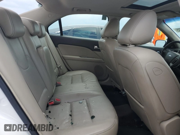 2010 Ford Fusion Hybrid z VIN 3FADP0L34AR186085, wystawiony jako Copart lot #55291735 z przebiegiem 282 029 mil mil oraz Szkody całkowita. Historia ofert i sprzedaży dostępna na DreamBid. Obrazek 10.