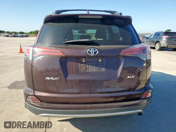 2018 Toyota RAV4 XLE with VIN 2T3WFREVXJW457073, listed as a Copart auction lot 62339635 with 75,321 mi miles and Salvage title. Bid and sale history available at DreamBid. Image 6.