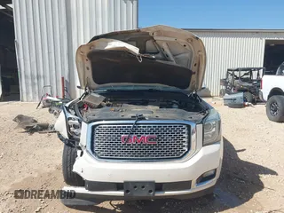 2015 GMC Yukon Denali with VIN 1GKS2CKJ3FR568729, listed as a IAAI auction lot 41741987 with 154,729 mi miles. Bid and sale history available at carsss.com. Image 12.