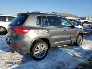 2014 Volkswagen Tiguan SE z VIN WVGAV3AXXEW505398, wystawiony jako Copart lot #41682155 z przebiegiem 137 147 mil mil oraz Nie do naprawy • Non repairable. Historia ofert i sprzedaży dostępna na DreamBid. Obrazek 3.