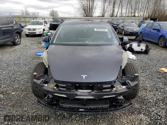 2025 Tesla Model 3 Long Range with VIN 5YJ3E1EA5SF889727, listed as a Copart auction lot 49207545 with 6,980 mi miles and Salvage Title. Bid and sale history available at carsss.com. Image 5.