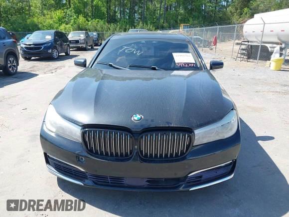 2016 BMW 7 Series 740i with VIN WBA7E2C55GG547752, listed as a IAAI auction lot 41992704 with Not Provided miles and . Bid and sale history available at carsss.com. Image 6.