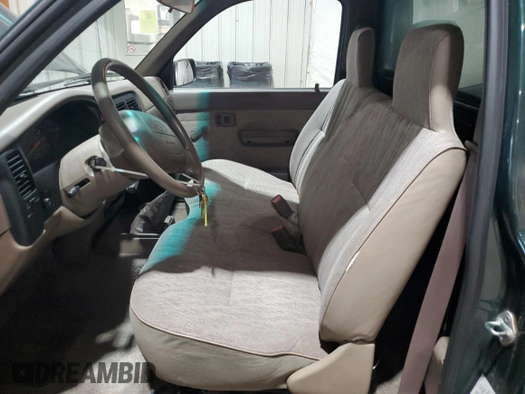 1999 Toyota Tacoma with VIN 4TANL42N4XZ453505, listed as a Copart auction lot 63399325 with 175,198 mi miles and Salvage title. Bid and sale history available at DreamBid. Image 7.