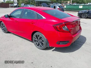 2021 Honda Civic Sport with VIN 2HGFC2F84MH536320, listed as a IAAI auction lot 42145631 with 50,664 mi miles and . Bid and sale history available at DreamBid. Image 3.