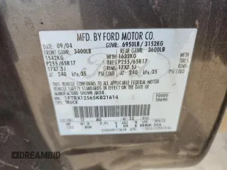 2005 Ford F-150 XLT with VIN 1FTRX12565KB21614, listed as a Copart auction lot 61488075 with 202,747 mi miles and Salvage title. Bid and sale history available at DreamBid. Image 12.