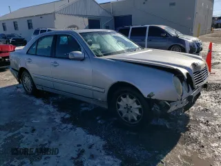 2000 Mercedes-Benz E-Class with VIN WDBJF82J5YX030071, listed as a Copart auction lot 42430025 with 122,612 mi miles and Salvage Title. Bid and sale history available at carsss.com. Image 4.