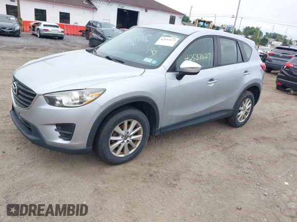 2016 Mazda CX-5 Sport z VIN JM3KE4BY1G0711602, wystawiony jako IAAI lot #42537627 z przebiegiem Nie podano mil oraz . Historia ofert i sprzedaży dostępna na DreamBid. Obrazek 2.