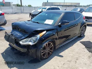 2016 Hyundai Veloster Turbo with VIN KMHTC6AE5GU281597, listed as a IAAI auction lot 42006038 with 77,642 mi miles. Bid and sale history available at carsss.com. Image 2.
