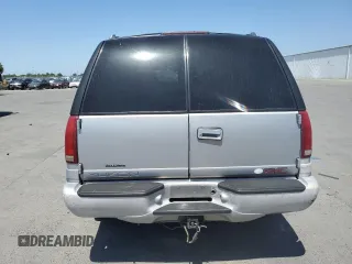 1999 GMC Denali z VIN 1GKEK13R6XR914411, wystawiony jako Copart lot #56063555 z przebiegiem 231 344 mil mil oraz Szkoda całkowita • Salvage title. Historia ofert i sprzedaży dostępna na DreamBid. Obrazek 6.