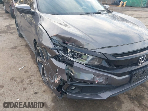 2019 Honda Civic Sport with VIN 2HGFC2F8XKH503867, listed as a IAAI auction lot 41533506 with 66,650 mi miles and . Bid and sale history available at DreamBid. Image 6.