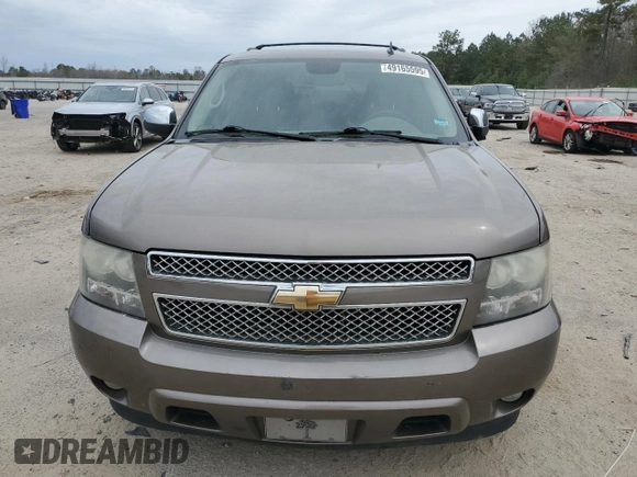 2011 Chevrolet Tahoe LS with VIN 1GNSCAE09BR138852, listed as a Copart auction lot 49165595 with 207,548 mi miles and Salvage title. Bid and sale history available at DreamBid. Image 5.