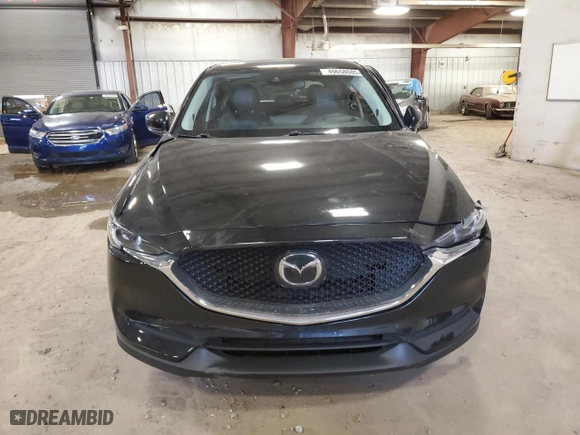 2021 Mazda CX-5 Grand Touring Reserve with VIN JM3KFBAY7M0308125, listed as a Copart auction lot 49658085 with 76,470 mi miles and Clean Title. Bid and sale history available at carsss.com. Image 5.