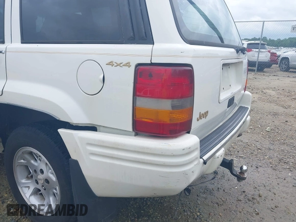 1996 Jeep Grand Cherokee Limited z VIN 1J4GZ78YXTC191527, wystawiony jako IAAI lot #42352616 z przebiegiem 325 927 mil mil oraz . Historia ofert i sprzedaży dostępna na DreamBid. Obrazek 6.