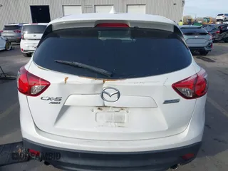 2015 Mazda CX-5 Grand Touring with VIN JM3KE4DY3F0483629, listed as a IAAI auction lot 41054059 with 118,980 mi miles. Bid and sale history available at carsss.com. Image 15.