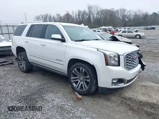 2019 GMC Yukon Denali with VIN 1GKS1CKJ7KR364240, listed as a IAAI auction lot 41645374 with 104,956 mi miles. Bid and sale history available at carsss.com. Image 1.