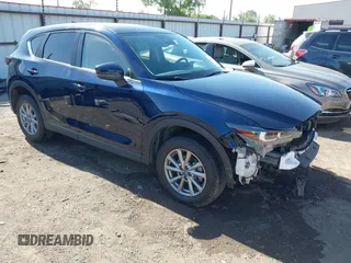 2023 Mazda CX-5 S Carbon Edition z VIN JM3KFBCM2P0250701, wystawiony jako IAAI lot #42272818 z przebiegiem 11 949 mil mil oraz . Historia ofert i sprzedaży dostępna na DreamBid. Obrazek 1.