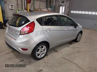 2016 Ford Fiesta SE with VIN 3FADP4EJ9GM197205, listed as a IAAI auction lot 41815313 with 115,689 mi miles. Bid and sale history available at carsss.com. Image 4.