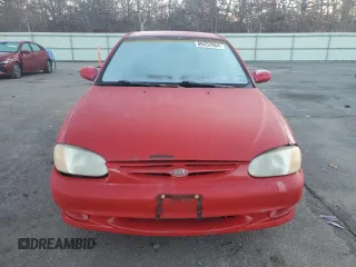 2001 Kia Sephia z VIN KNAFB121715066725, wystawiony jako Copart lot #86552964 z przebiegiem 76 915 mil mil oraz Tytuł czysty. Historia ofert i sprzedaży dostępna na DreamBid. Obrazek 5.