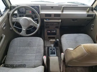1990 Mitsubishi Montero z VIN JA4GJ31S2LJ003083, wystawiony jako Copart lot #73539314 z przebiegiem 115 191 mil mil oraz Nie do naprawy • Non repairable. Historia ofert i sprzedaży dostępna na DreamBid. Obrazek 8.