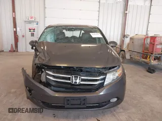 2014 Honda Odyssey Touring with VIN 5FNRL5H99EB105059, listed as a IAAI auction lot 42457672 with 240,581 mi miles and . Bid and sale history available at DreamBid. Image 12.