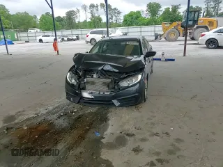 2017 Honda Civic LX z VIN 19XFC2F54HE014695, wystawiony jako Copart lot #57439725 z przebiegiem 88 092 mil mil oraz Szkoda całkowita • Salvage title. Historia ofert i sprzedaży dostępna na DreamBid. Obrazek 13.