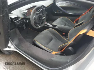2023 McLaren Artura z VIN SBM16AEA4PW001953, wystawiony jako Copart lot #88790405 z przebiegiem 6864 mil mil oraz Nie do naprawy. Historia ofert i sprzedaży dostępna na DreamBid. Obrazek 8.