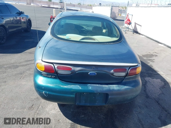 1996 Ford Taurus LX with VIN 1FALP53S0TG125665, listed as a IAAI auction lot 42290691 with 91,152 mi miles and . Bid and sale history available at DreamBid. Image 14.