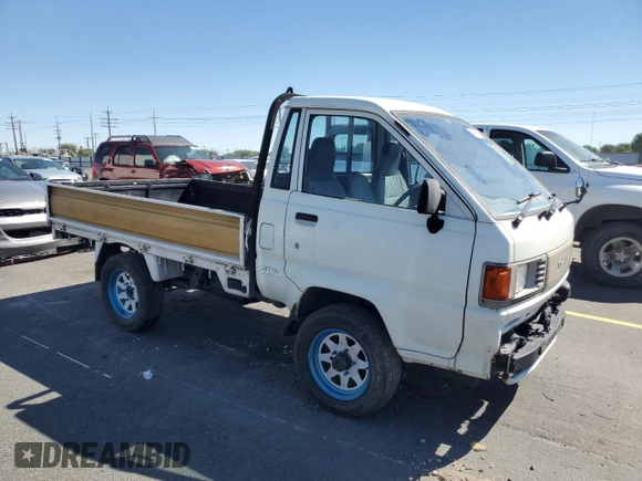 1994 Toyota Tacoma with VIN CM600012981, listed as a Copart auction lot 64052155 with 237,536 mi miles and Salvage title. Bid and sale history available at DreamBid. Image 4.