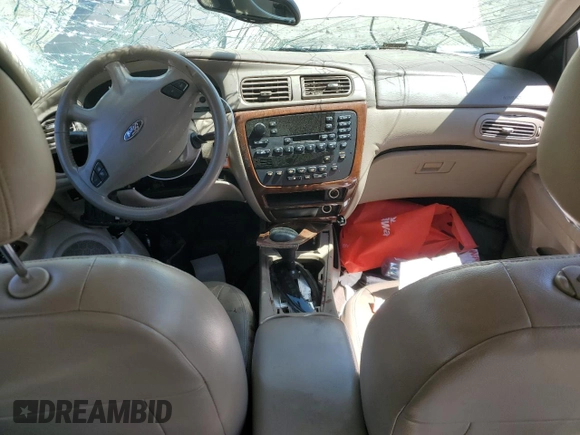 2003 Ford Taurus SEL Deluxe with VIN 1FAHP56SX3G199970, listed as a Copart auction lot 53042795 with 212,802 mi miles and Salvage Title. Bid and sale history available at DreamBid. Image 8.
