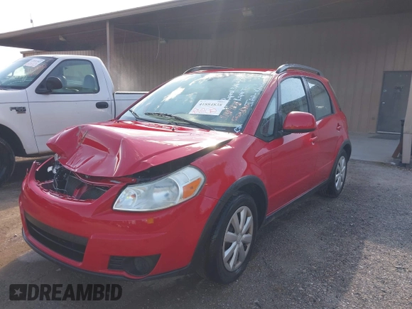 2010 Suzuki SX4 with VIN JS2YB5A34A6301801, listed as a IAAI auction lot 41884838 with 124,381 mi miles. Bid and sale history available at carsss.com. Image 2.