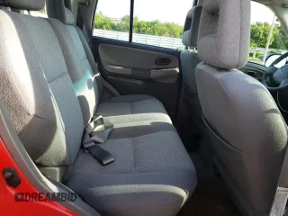 2003 Chevrolet Tracker z VIN 2CNBE13CX36943395, wystawiony jako Copart lot #70964574 z przebiegiem 118 975 mil mil oraz Szkody całkowita. Historia ofert i sprzedaży dostępna na DreamBid. Obrazek 11.