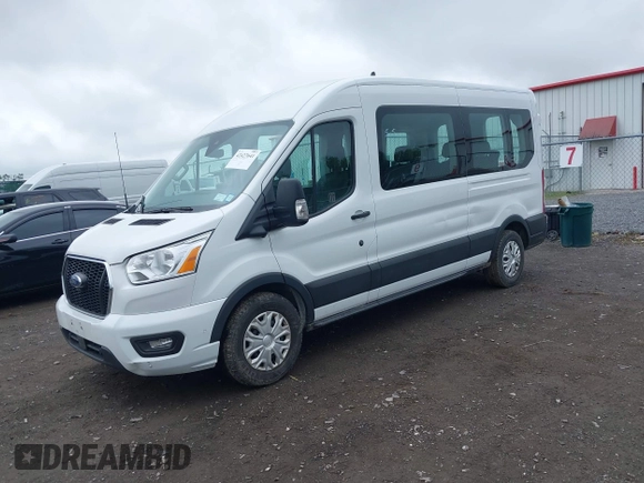 2022 Ford Transit Passenger XL with VIN 1FBAX2C86NKA79221, listed as a IAAI auction lot 42427641 with 56,245 mi miles and . Bid and sale history available at DreamBid. Image 2.